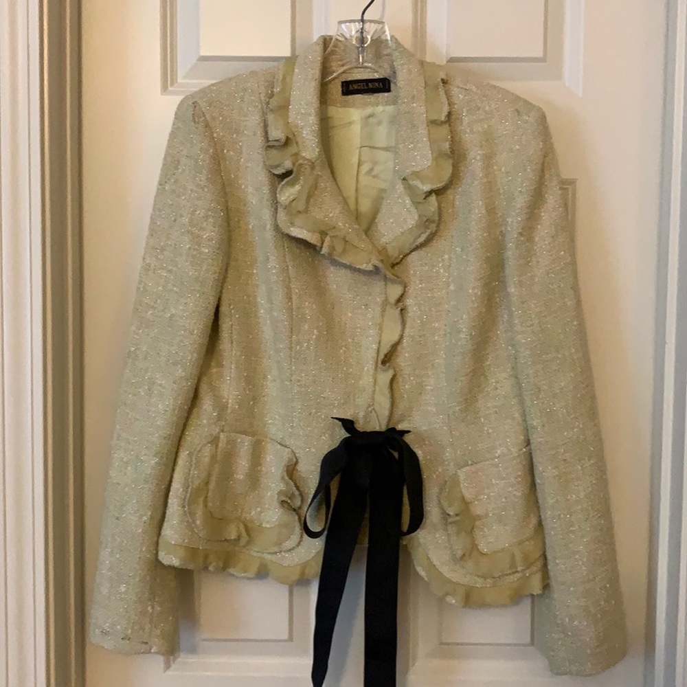 Sparkly jacket with ruffles. Light green and pink.
